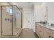 Modern bathroom featuring a glass shower, double sinks, and modern fixtures and finishes at 525 Monarch Ridge Ct, North Las Vegas, NV 89084