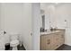 Powder room has a dual sink vanity and a separated toilet for maximum privacy and convenience at 525 Monarch Ridge Ct, North Las Vegas, NV 89084