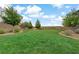 Scenic community park with lush green grass, mature trees, and walking paths at 525 Monarch Ridge Ct, North Las Vegas, NV 89084