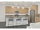 Kitchen island with pendant lights, stainless steel appliances, and modern cabinetry at 525 Monarch Ridge Ct, North Las Vegas, NV 89084