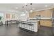 Spacious kitchen with a large island, modern appliances, pendant lighting, and dining area at 525 Monarch Ridge Ct, North Las Vegas, NV 89084