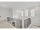 Bright landing with white walls, staircase, and recessed lighting at 525 Monarch Ridge Ct, North Las Vegas, NV 89084