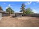 Backyard view featuring a storage shed and potential for landscaping and customization at 5867 Bunch St, Las Vegas, NV 89122