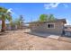 Expansive backyard features a covered patio area, separate storage shed, and plenty of space at 5867 Bunch St, Las Vegas, NV 89122