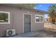 Side of the house with white trim and a chain link fence at 5867 Bunch St, Las Vegas, NV 89122