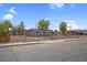 Single story home with a chain link fence and a gray exterior at 5867 Bunch St, Las Vegas, NV 89122