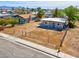 This home features a low fence, making it inviting and providing security at 5867 Bunch St, Las Vegas, NV 89122