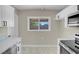 Modern kitchen with all white cabinets and stainless steel appliances at 5867 Bunch St, Las Vegas, NV 89122
