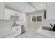 Modern kitchen with all white cabinets and stainless steel appliances at 5867 Bunch St, Las Vegas, NV 89122