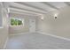 Bright living room with white ceiling and light grey marble flooring at 5867 Bunch St, Las Vegas, NV 89122