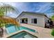 Backyard with a pool, patio, and lush tropical landscaping at 5903 Karnes Ranch Ave, Las Vegas, NV 89131