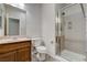 Bright bathroom featuring a vanity, toilet, and a glass enclosed shower at 5903 Karnes Ranch Ave, Las Vegas, NV 89131