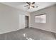 Neutral bedroom with ceiling fan, carpet flooring, closet, and window light at 5903 Karnes Ranch Ave, Las Vegas, NV 89131