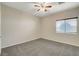 Neutral bedroom with ceiling fan, carpet flooring and bright window light at 5903 Karnes Ranch Ave, Las Vegas, NV 89131