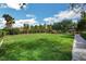 Large manicured common area featuring grass, trees, gazebo, and walking path under a blue sky at 5903 Karnes Ranch Ave, Las Vegas, NV 89131