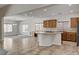 Open concept kitchen with island flows into dining room, perfect for entertaining at 5903 Karnes Ranch Ave, Las Vegas, NV 89131