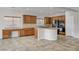 Bright kitchen features custom cabinets, granite countertops, and a center island at 5903 Karnes Ranch Ave, Las Vegas, NV 89131