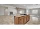 Spacious kitchen island with cooktop and open floor plan to living room at 5903 Karnes Ranch Ave, Las Vegas, NV 89131