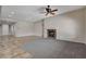 Open-concept living area with a fireplace, tiled floors, and recessed lighting at 5903 Karnes Ranch Ave, Las Vegas, NV 89131