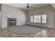Bright living space featuring tile flooring, a modern fireplace, and large windows at 5903 Karnes Ranch Ave, Las Vegas, NV 89131