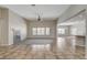 Expansive living space with a modern fireplace, tile flooring, and ample natural light at 5903 Karnes Ranch Ave, Las Vegas, NV 89131