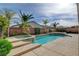 Inviting backyard pool with spa and lush landscaping at 5903 Karnes Ranch Ave, Las Vegas, NV 89131