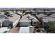 Aerial view of a single-Gathering home featuring desert landscaping, a tile roof, and an attached two-car garage at 5965 Sierra Medina Ave, Las Vegas, NV 89139