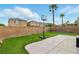 Back yard with artificial turf, a basketball hoop, and tall palm trees at 5965 Sierra Medina Ave, Las Vegas, NV 89139