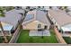 Backyard featuring artificial grass, perfect for outdoor entertaining, and solar panels on the roof at 5965 Sierra Medina Ave, Las Vegas, NV 89139