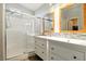 Contemporary bathroom with dual vanities and walk-in shower at 5965 Sierra Medina Ave, Las Vegas, NV 89139