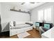 This bedroom features a daybed, dark wood floors, and stylish decor at 5965 Sierra Medina Ave, Las Vegas, NV 89139