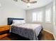 Comfortable bedroom features a queen-sized bed and dark wood floors at 5965 Sierra Medina Ave, Las Vegas, NV 89139
