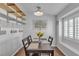 Cozy dining room with modern light fixture, stylish shelving, and lots of natural light at 5965 Sierra Medina Ave, Las Vegas, NV 89139