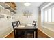Cozy dining room features a dark wood table and chair set with decorative shelves at 5965 Sierra Medina Ave, Las Vegas, NV 89139