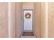 Charming front door adorned with a decorative wreath, textured wall, and welcome mat at 5965 Sierra Medina Ave, Las Vegas, NV 89139