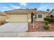 Charming single-story home with a well-maintained front yard and two car garage at 5965 Sierra Medina Ave, Las Vegas, NV 89139