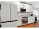 Modern kitchen featuring stainless steel appliances and ample counter space and white cabinets at 5965 Sierra Medina Ave, Las Vegas, NV 89139