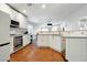 Modern kitchen features white cabinets and stainless steel appliances at 5965 Sierra Medina Ave, Las Vegas, NV 89139
