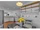 Eat-in kitchen with stainless steel appliances, open shelving, and a black dining set at 5965 Sierra Medina Ave, Las Vegas, NV 89139