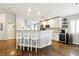 Inviting kitchen featuring white cabinetry, stainless steel appliances, and seating area at 5965 Sierra Medina Ave, Las Vegas, NV 89139