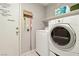 Convenient laundry area includes a modern washer and dryer at 5965 Sierra Medina Ave, Las Vegas, NV 89139
