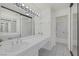 Bright bathroom with a long countertop, vanity mirror and tiled shower at 6250 W Flamingo Rd # 51, Las Vegas, NV 89103