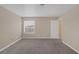 Neutral bedroom with large window for natural light and soft gray carpet at 6250 W Flamingo Rd # 51, Las Vegas, NV 89103