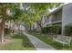 A common area with well maintained grass, sidewalk, and shrubbery provides a great place to relax at 6250 W Flamingo Rd # 51, Las Vegas, NV 89103