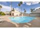 A beautiful community pool surrounded by tall palm trees for a resort-like feel at 6250 W Flamingo Rd # 51, Las Vegas, NV 89103