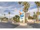 The 'La Mirage' community sign is surrounded by beautiful landscaping and palm trees at 6250 W Flamingo Rd # 51, Las Vegas, NV 89103