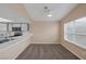 This dining area has neutral walls and trim, as well as a breakfast bar and a view of a large window at 6250 W Flamingo Rd # 51, Las Vegas, NV 89103