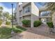 Charming condominium with manicured lawn, shrubs, rock landscaping, and walking path for great curb appeal at 6250 W Flamingo Rd # 51, Las Vegas, NV 89103