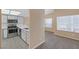 Bright kitchen featuring gray cabinets and countertops, stainless steel appliances, and hardwood-style flooring at 6250 W Flamingo Rd # 51, Las Vegas, NV 89103