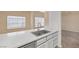 The kitchen features modern countertops, a stainless steel sink, and a breakfast bar that flows into the dining area at 6250 W Flamingo Rd # 51, Las Vegas, NV 89103